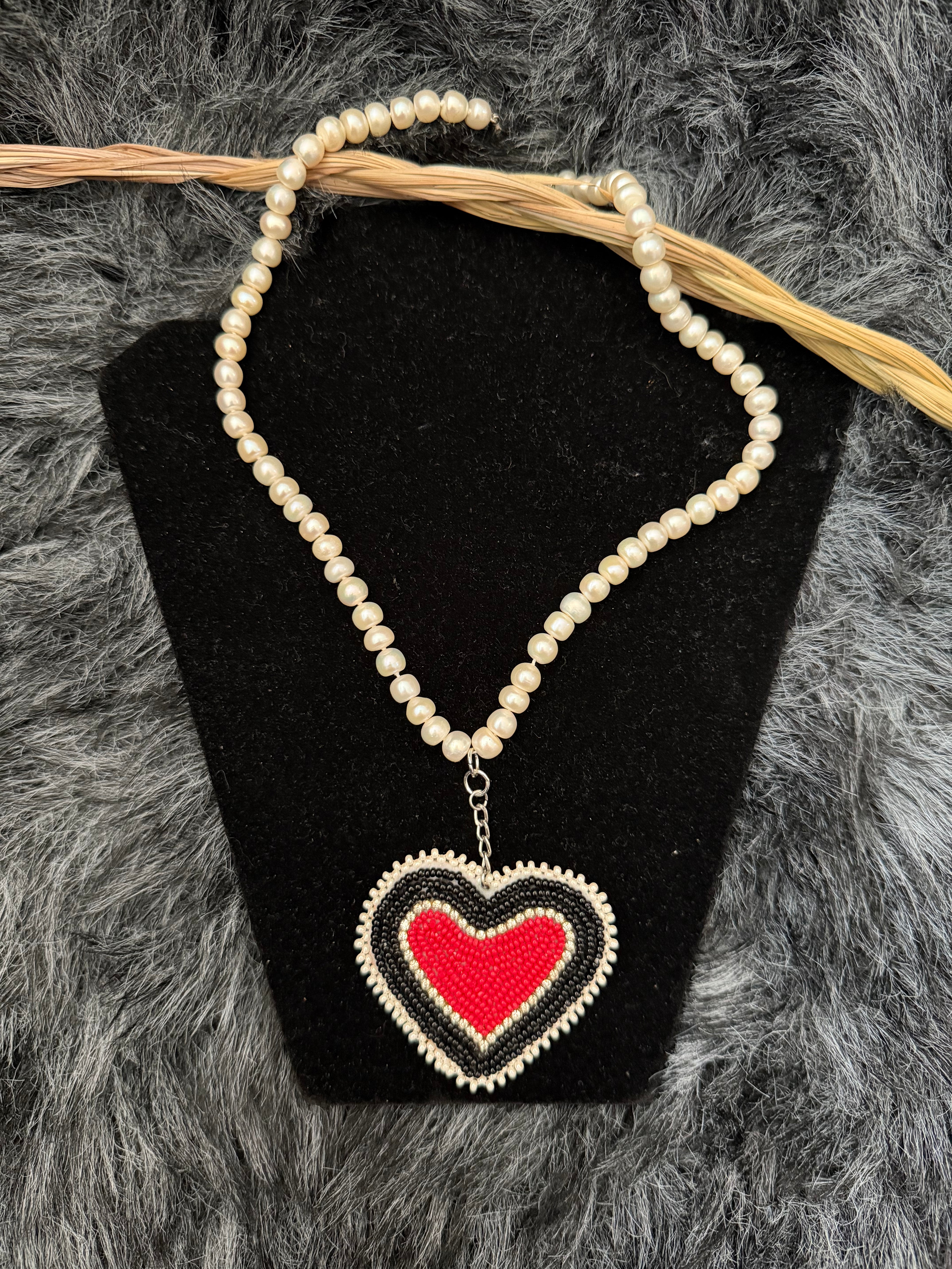 manitô-mîkis[sacred bead] • necklace